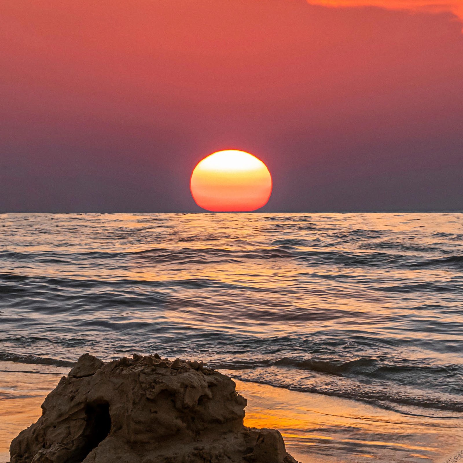 Download Sandcastles Under A Vibrant Sunset 2K iPhone