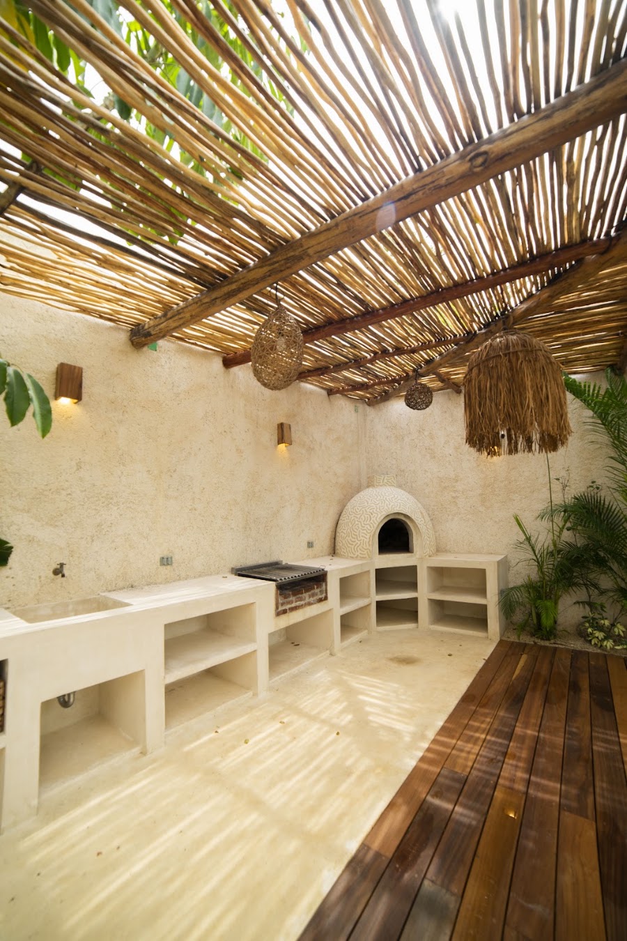 Shaded seating nook under the palapa