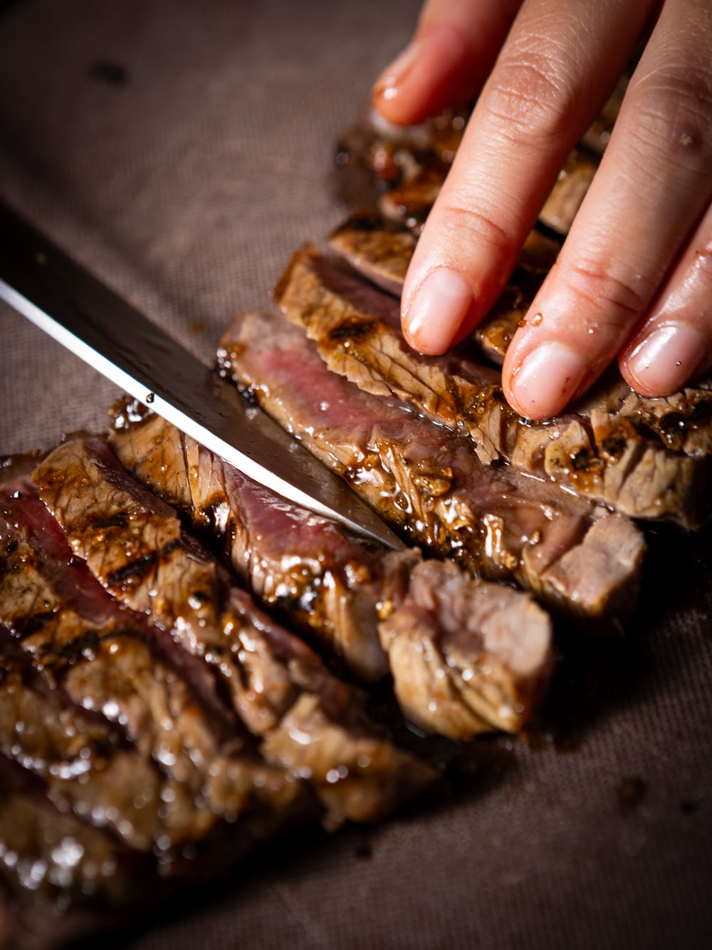 Crying Tiger — smoky grain-fed sirloin sliced off the charcoal grill