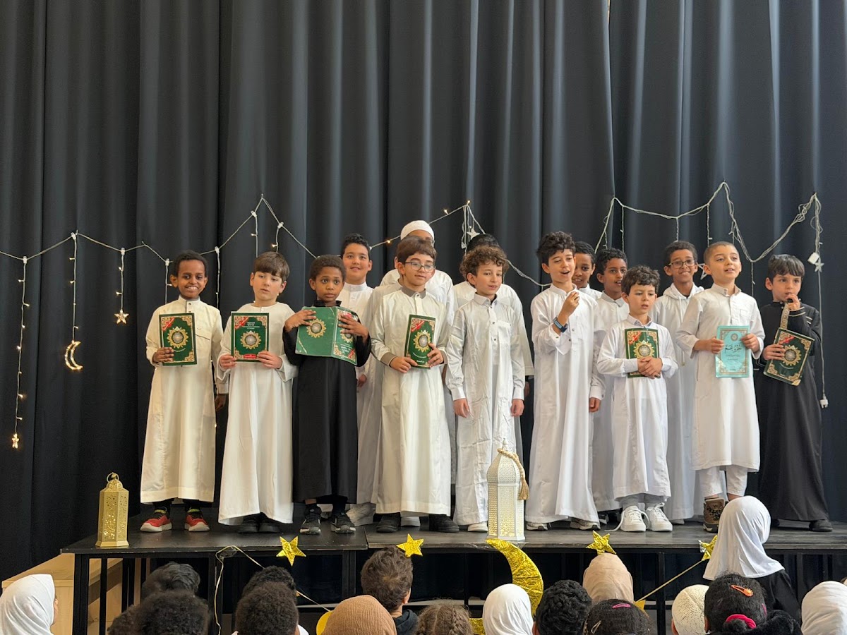 Boys receiving their Qurans at the end-of-year ceremony