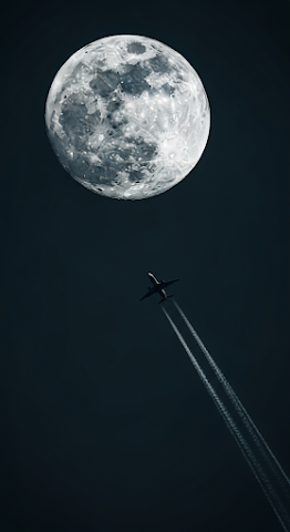 Airplane Flying Past Full Moon