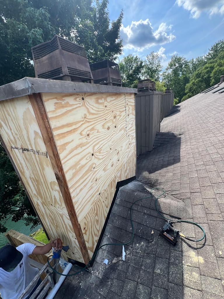 New plywood sheathing installed on the chimney at The Lookout, ready for siding