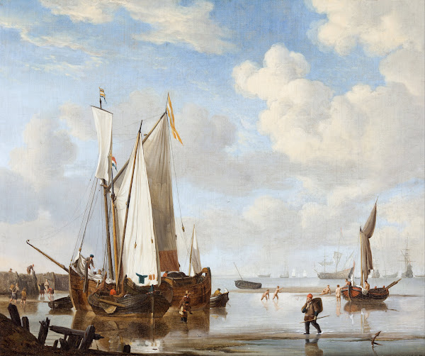 A wijdschip and a kaag in an inlet close to a sea wall