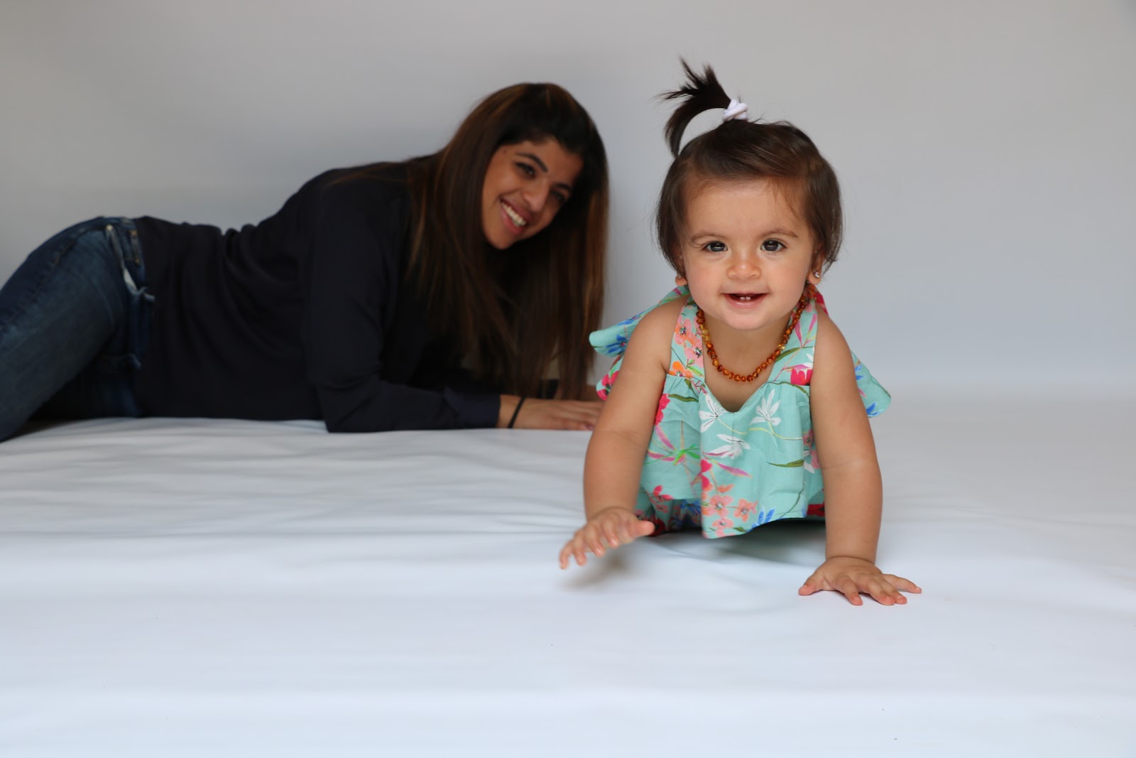 Baby pulling up to stand and exploring independently — baby development activities 9–12 months
