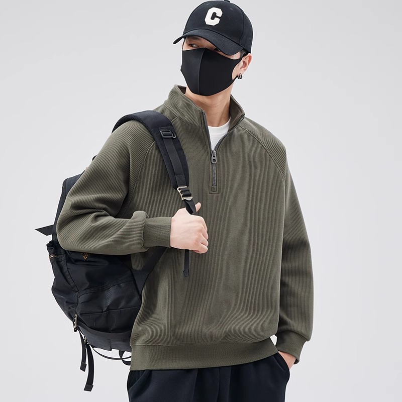Loose sweater with stand-up collar and zipper