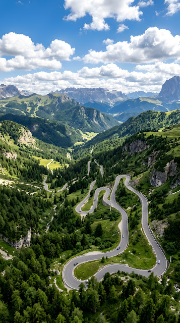 Aerial Perspective of a Winding Mountain Road Through Dense Forest - Free mobile Wallpaper