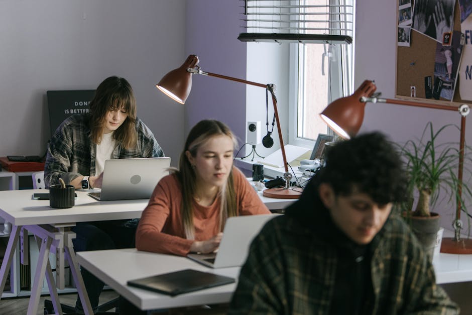 A professional but approachable scene of different users like a student, researcher, and marketer using AI tools on laptops, modern office environment