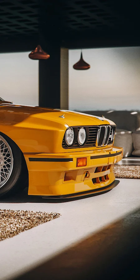 Yellow BMW E30 M3 Showroom 4K iPhone Phone Wallpaper