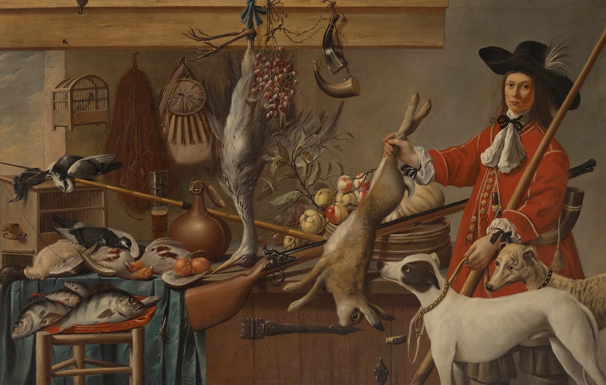 A huntsman holding a dead hare with his two dogs