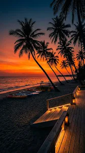 Orange Sunset Over Tropical Beach Resort with Palm Tree Silhouettes