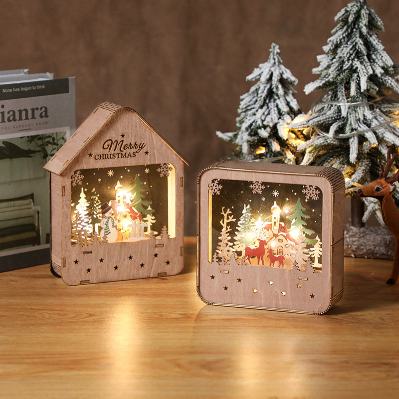 Beleuchtetes Holzhaus mit LED-Weihnachtsdeko