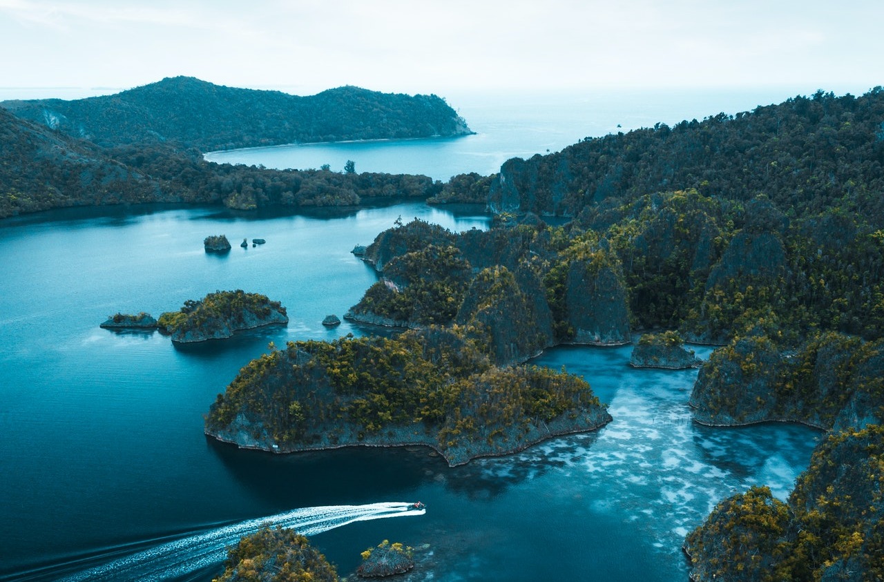Raja Ampat panorama view. Indonesia top beautiful interesting tourism destination, Bali tourism, Kepulauan seribu, Bintan island, Raja ampat island, Sumbawa, Morotai maluku. CarbonEthics Indonesia