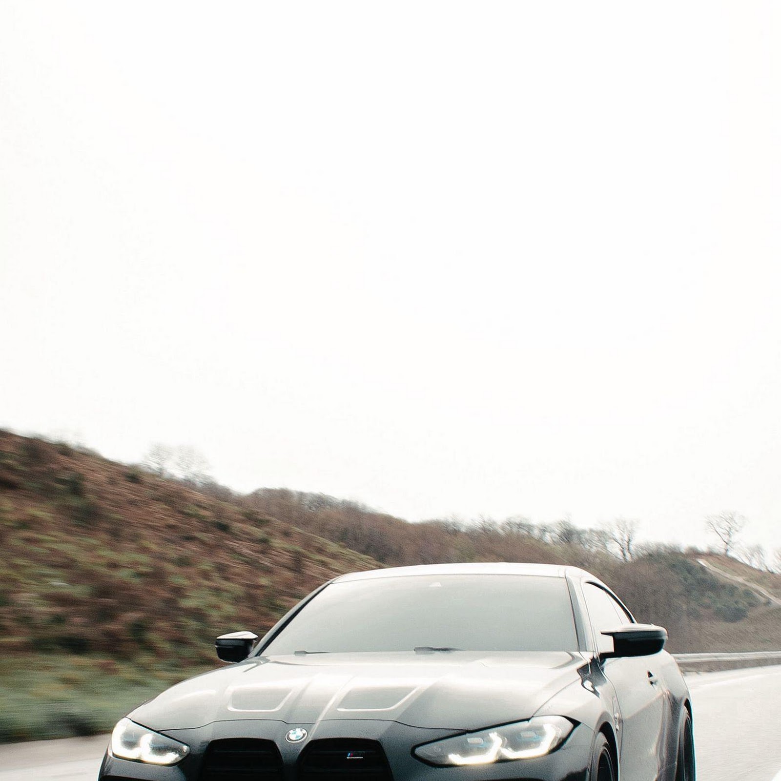 Download Black BMW M4 Speeding On Highway 2K iPhone