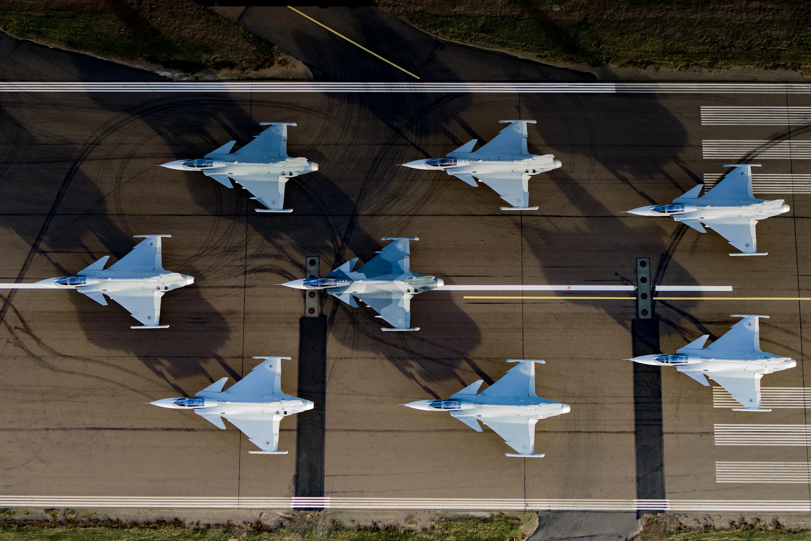 Eight Gripen Fighter Jets Lined Up - Aerial Photography 4K Wallpaper (4720x3147)