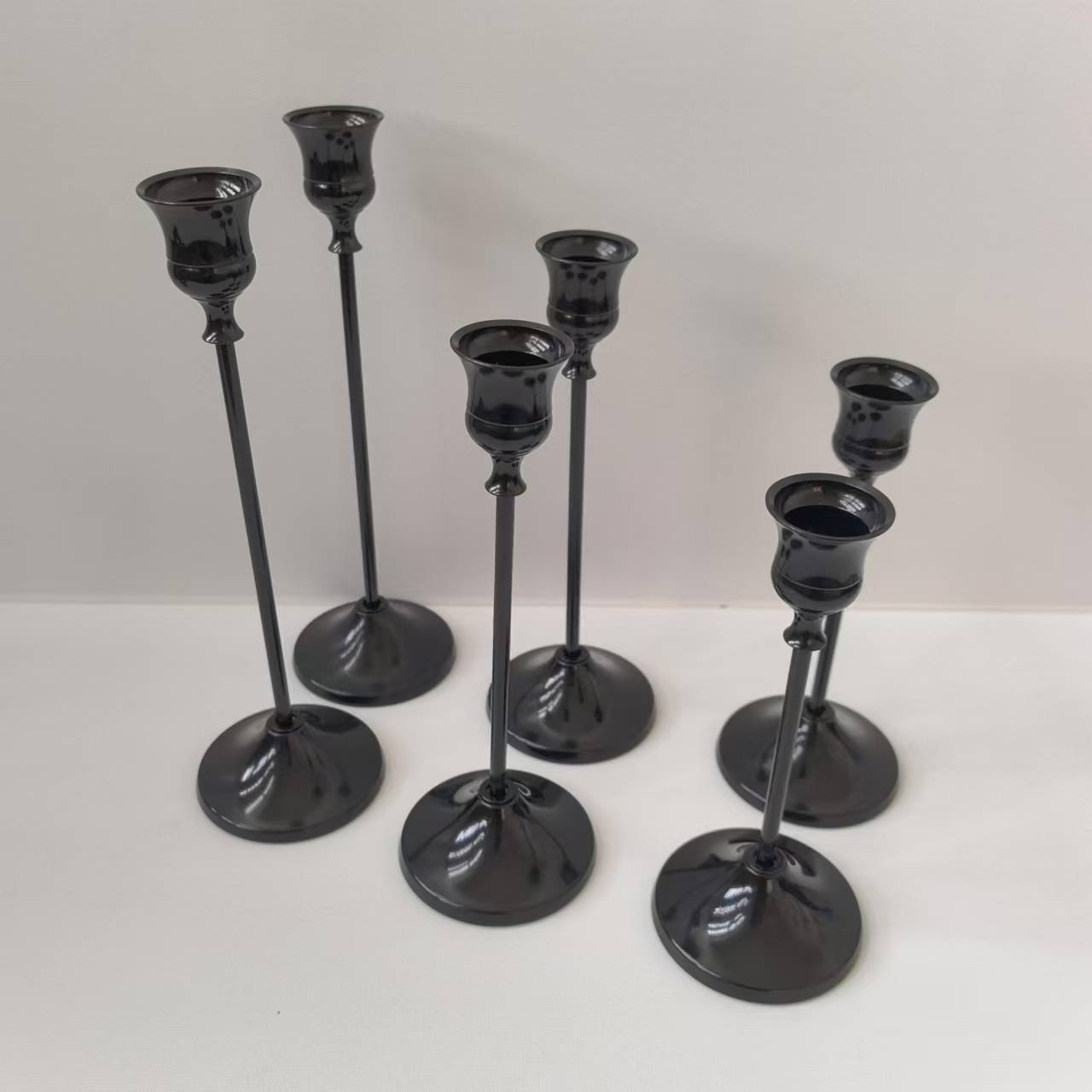Decorative metal candle holder in bell design
