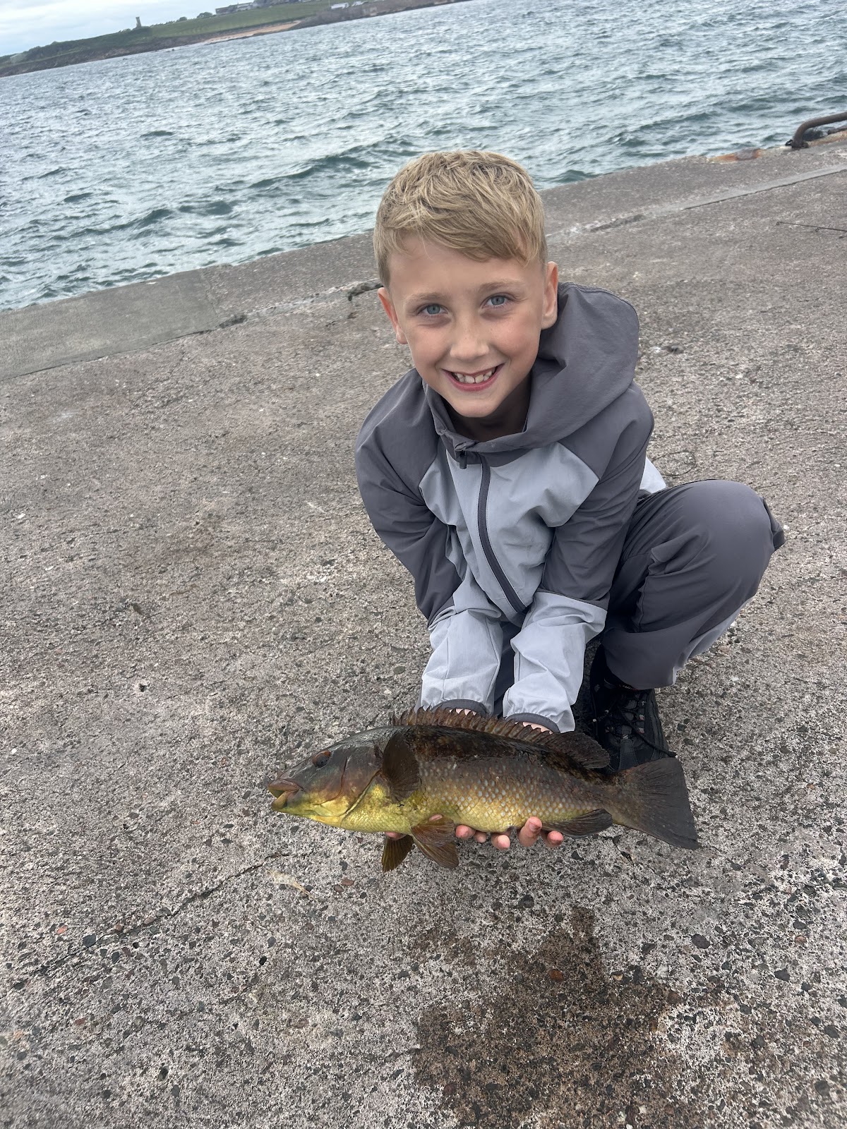 Brody Stevenson with a Wrasse caught on lugworm off Anstruther harbour