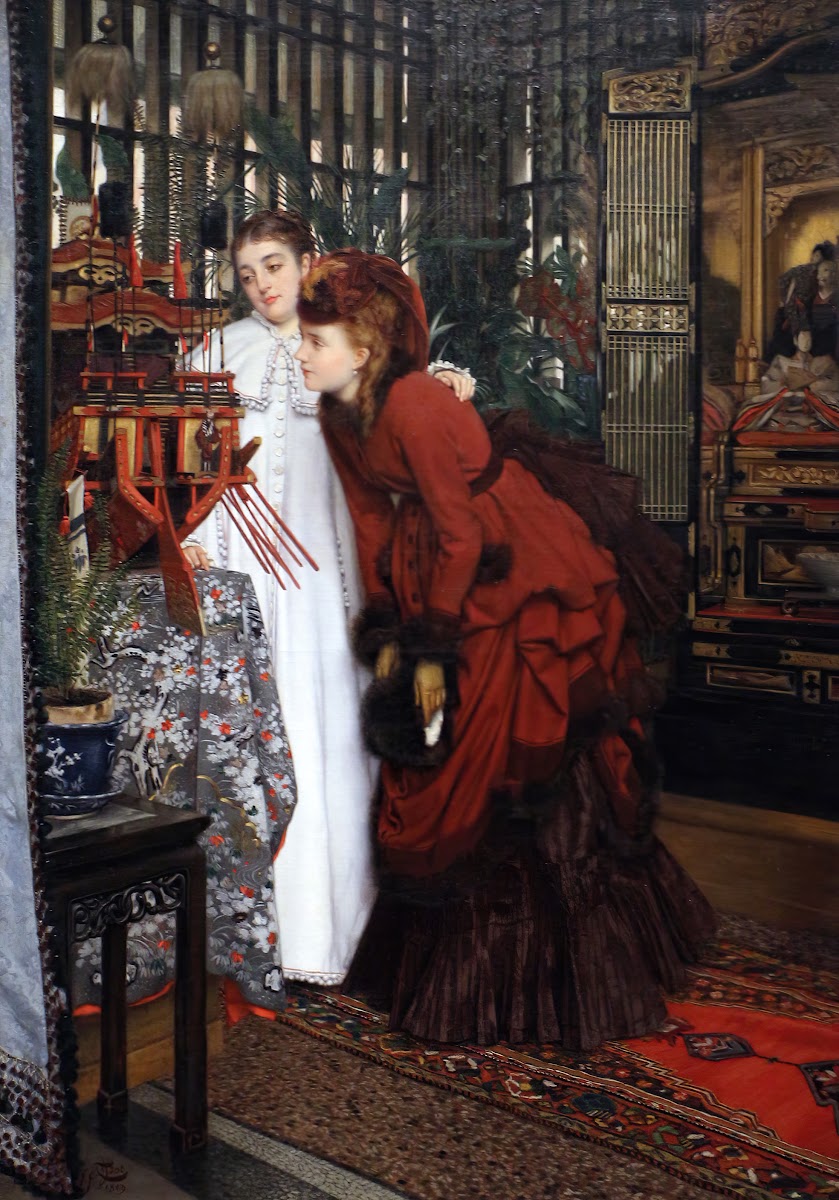 Young woman looking at Japanese items 1869