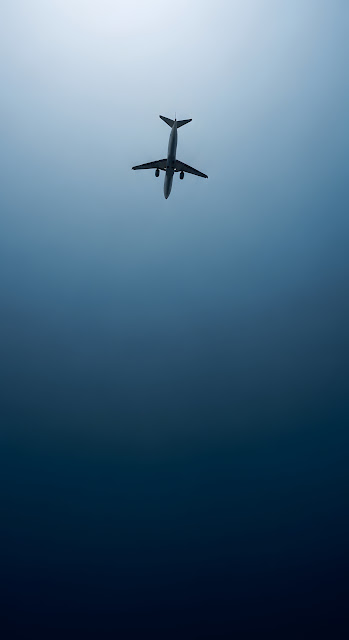 Commercial Jet Silhouette Against Deep Blue Gradient Sky - Free mobile Wallpaper