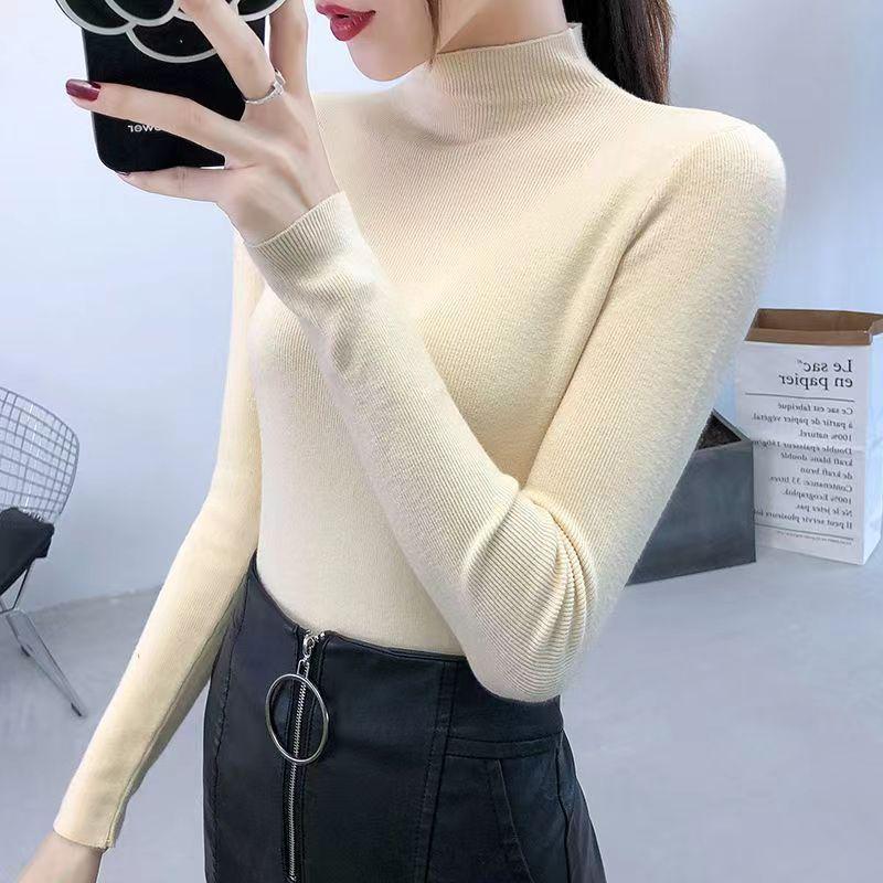 Women's knitted pullover with a stand-up collar, slim fit