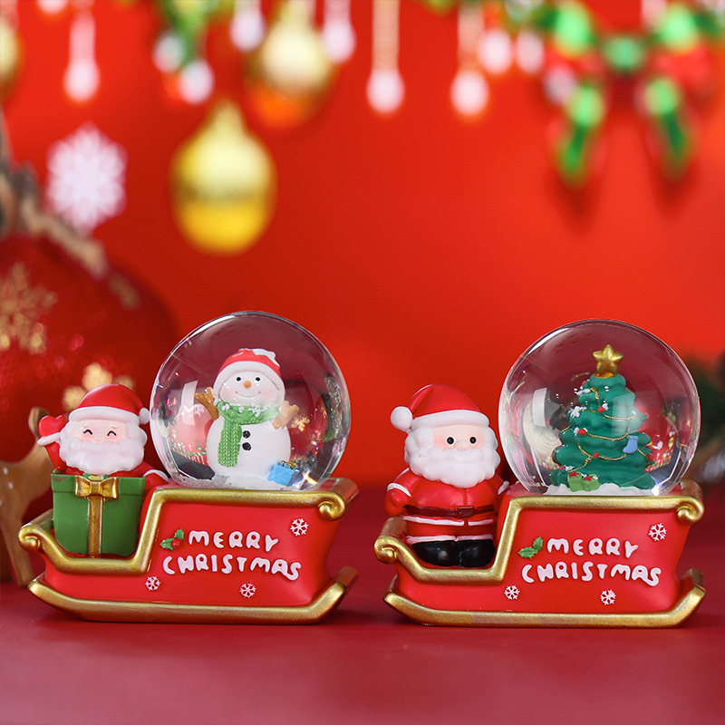 Luminous snow globe with Christmas motifs