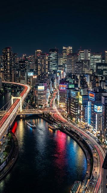 Hyper-Realistic Night Cityscape with Neon Skyscrapers and River Reflection - Free mobile Wallpaper