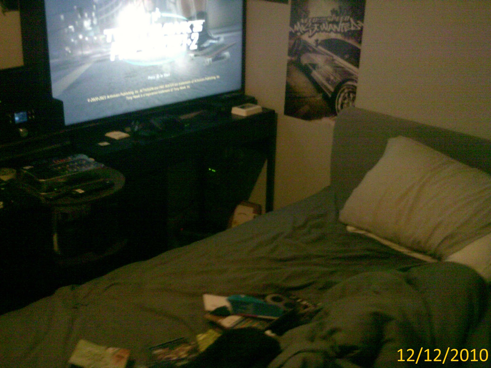 A dishevelled bed and messy overall room