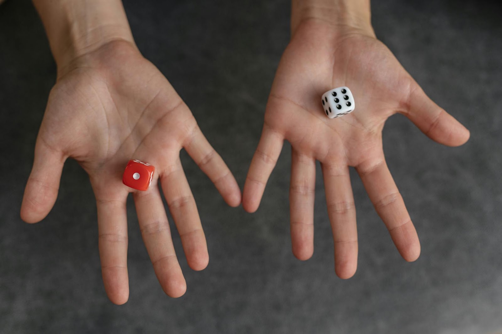 A human hand choosing between two paths, one clear and one obscured, representing making informed decisions about practical AI applications.