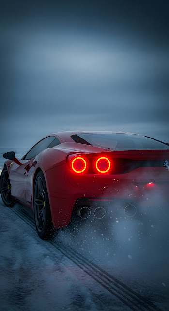 Red Ferrari Sports Car Drifting on Snowy Winter Road - Free mobile Wallpaper