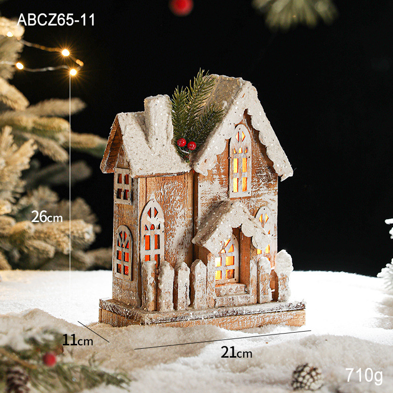 Lit wooden Christmas house in European retro style