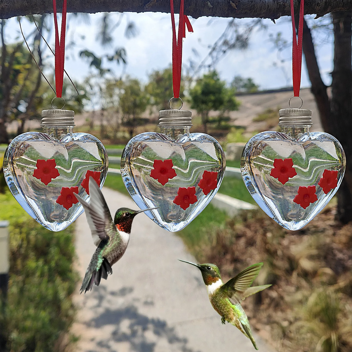 Hanging birdbath in heart shape with flower design