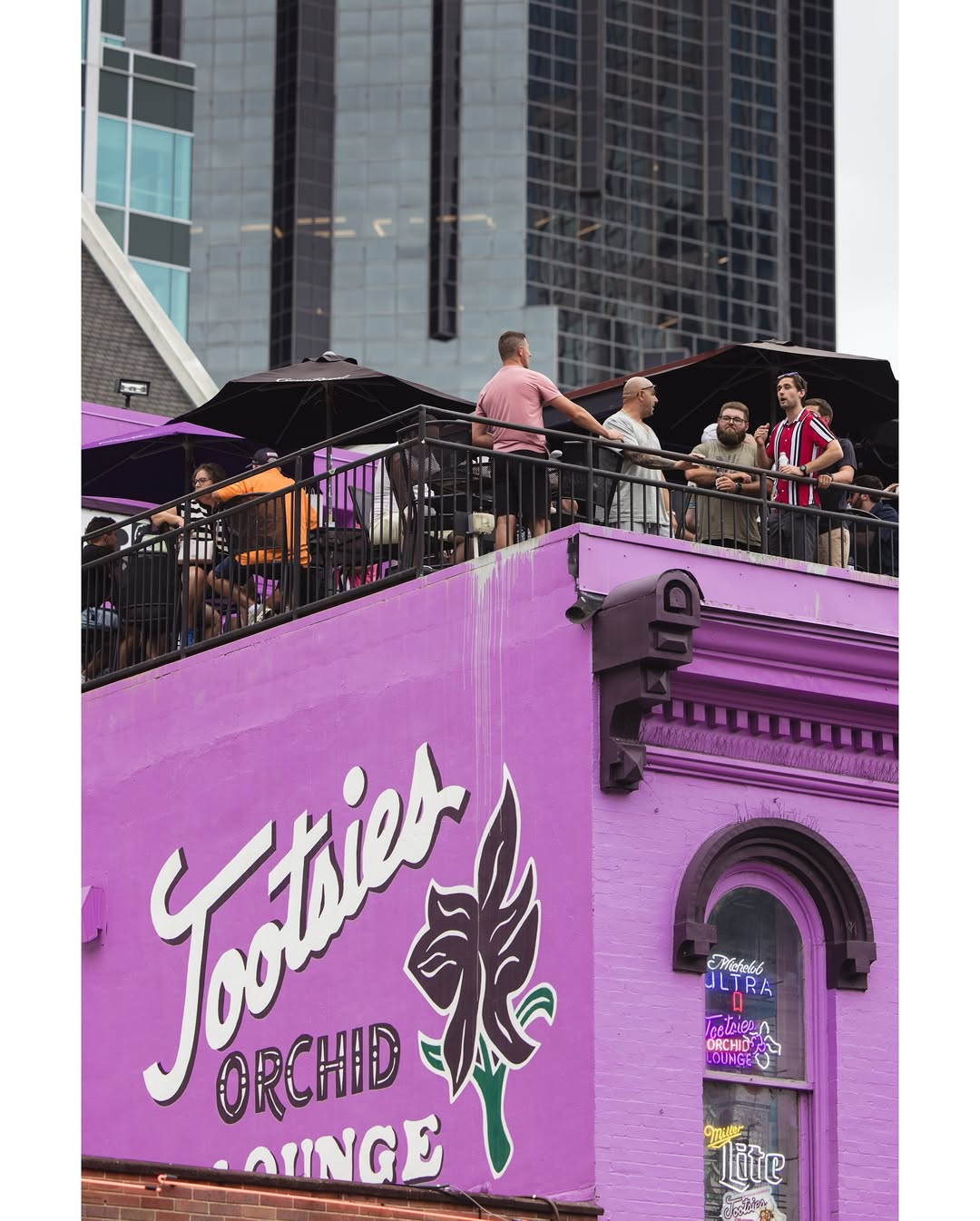 Interior of Layla's Honky Tonk showing vibrant decor, wooden flooring, and live performance stage