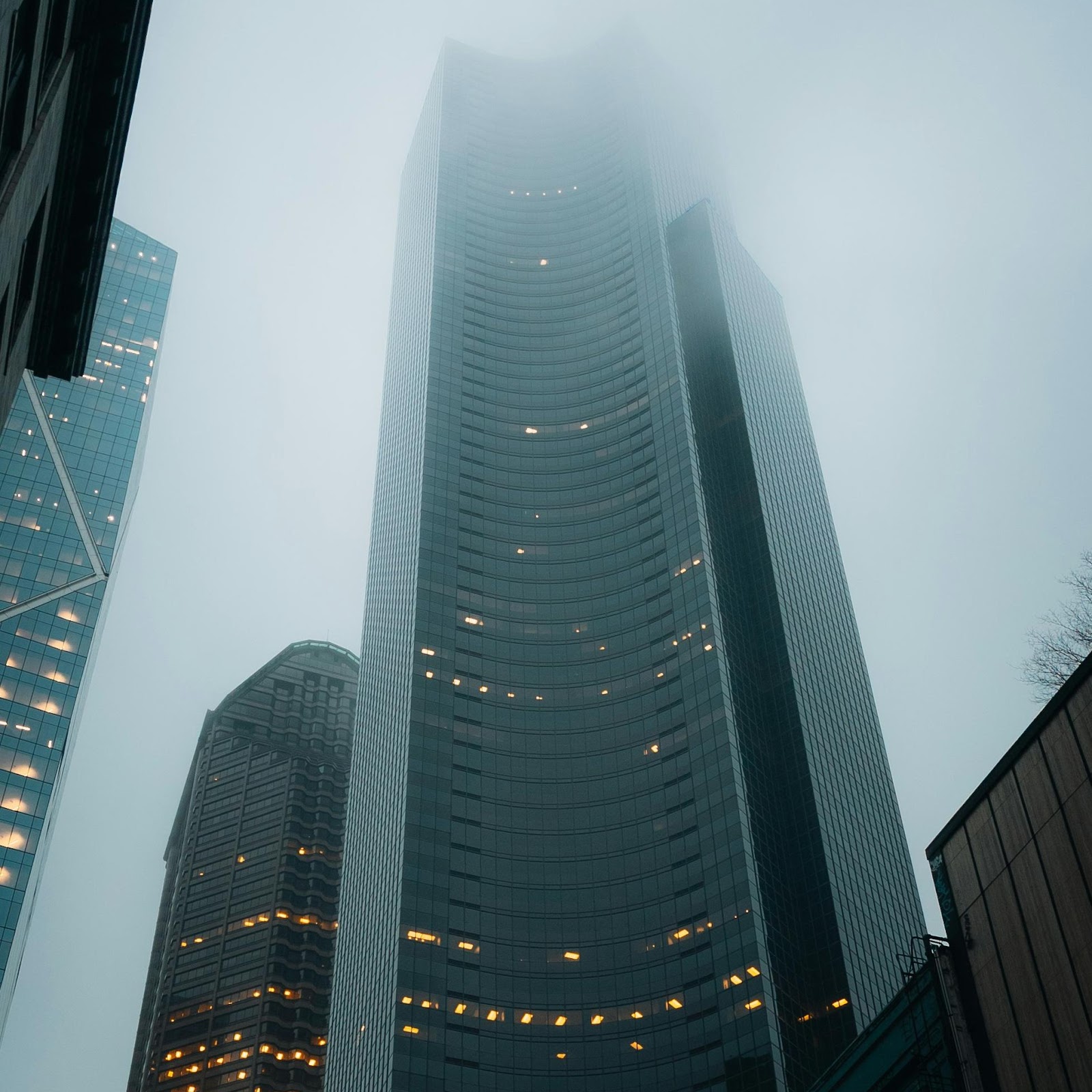 Download Moody Urban Skyscraper In Fog 2K iPhone