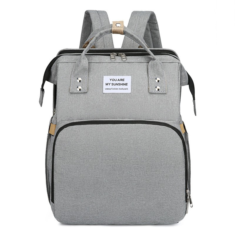 Diaper backpack with integrated changing pad