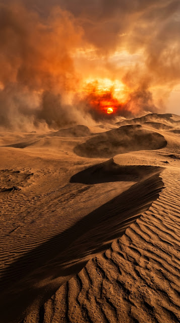 Photorealistic Desert Sunset with Fiery Sun and Swirling Sand Clouds - Free mobile Wallpaper