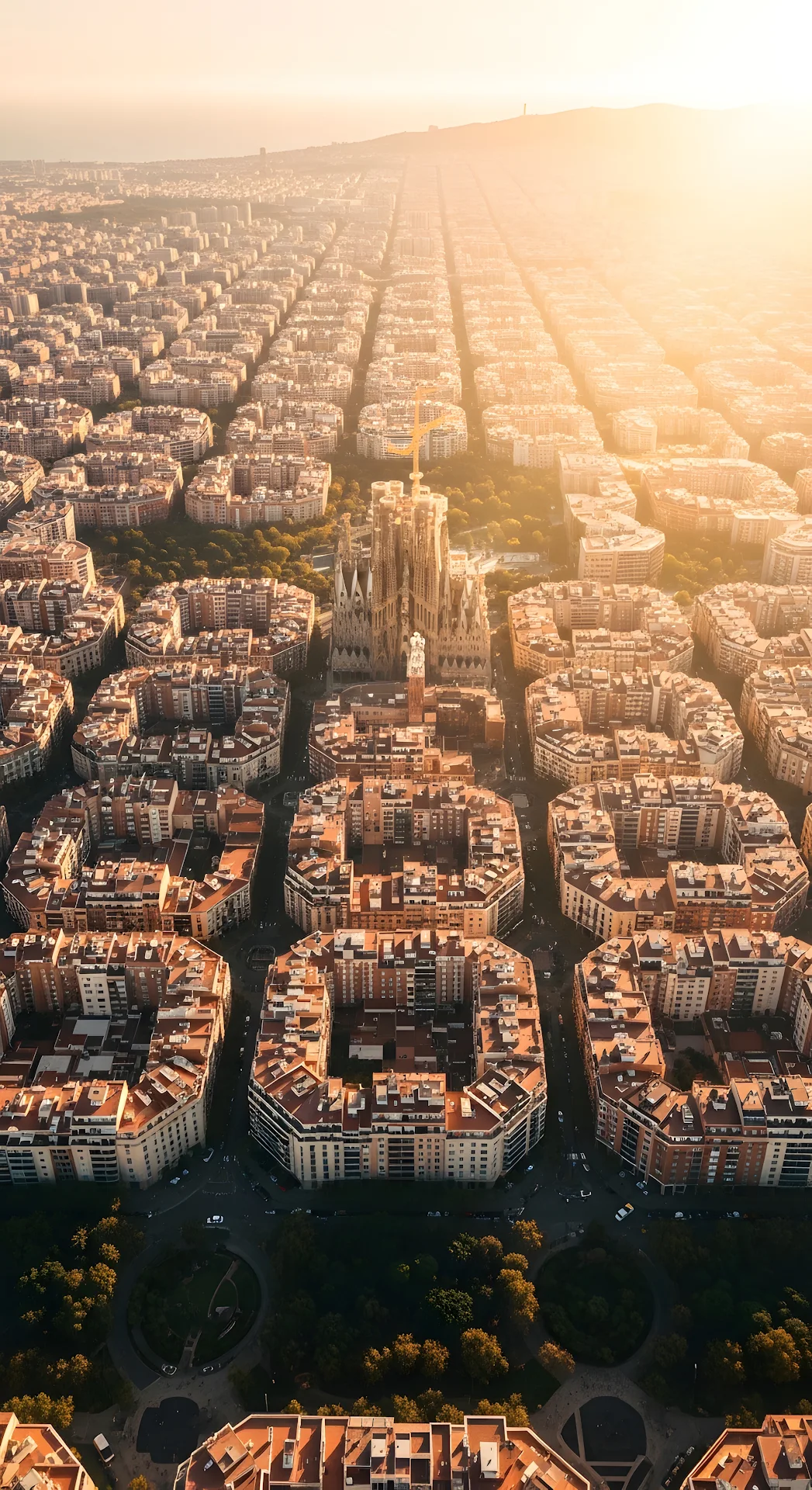 Aerial View of Sagrada Familia in Barcelona's Eixample Grid at Golden Hour - Free 4K mobile Wallpaper