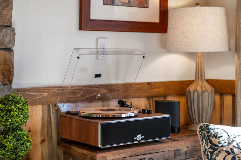 Living room with vinyl record player at Orchard & Vine Mountain Haus, Ellijay Georgia