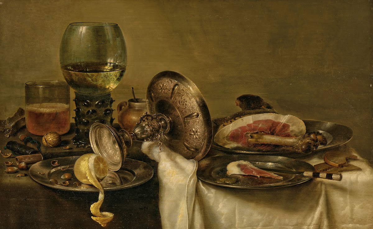 A partially draped table with an overturned tazza roemer and glass of beer with