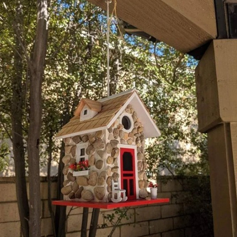 Decorative stone-look birdhouse made of resin