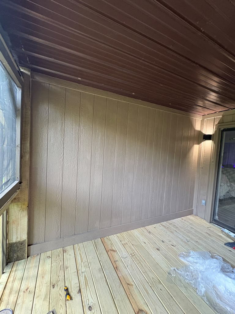 Finished balcony at The Lookout with new painted panel siding, dark ceiling and new deck boards