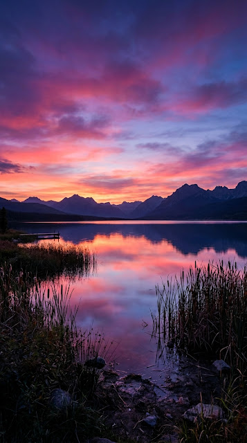 Serene Lakeside Sunset with Vibrant Purple and Pink Sky - Free mobile Wallpaper