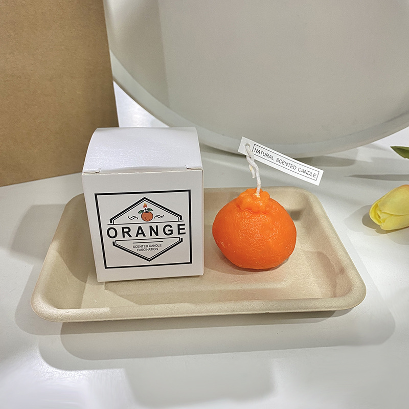 Handcrafted scented candle made of soy wax, fruit shape
