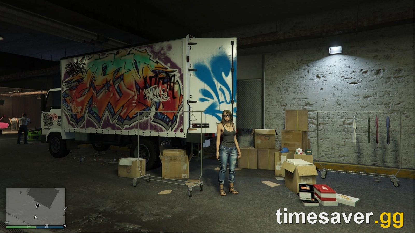 The GTA Online LS Car Meet Merch Store truck with clothing racks inside the car meet