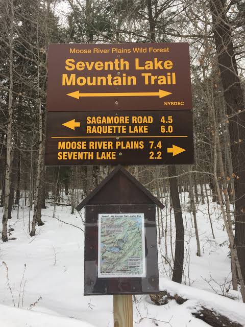 NYSDEC Seventh Lake Mountain Trail sign showing Raquette Lake 6.0 miles
