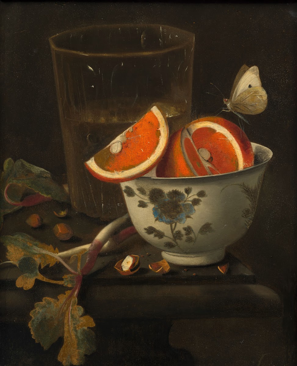 Orange in a porcelain bowl and chestnuts on an entablature