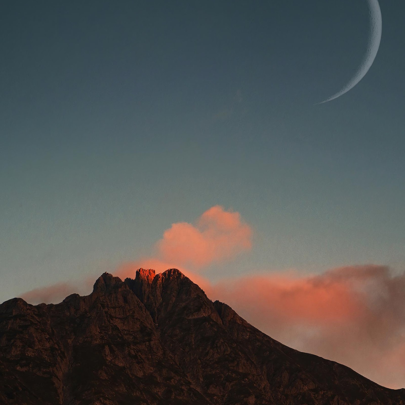 Download Crescent Moon Over Glowing Peak 2K iPhone