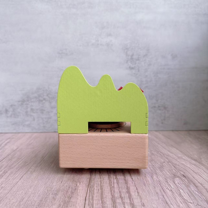 Manual music box made of beech wood with train motif