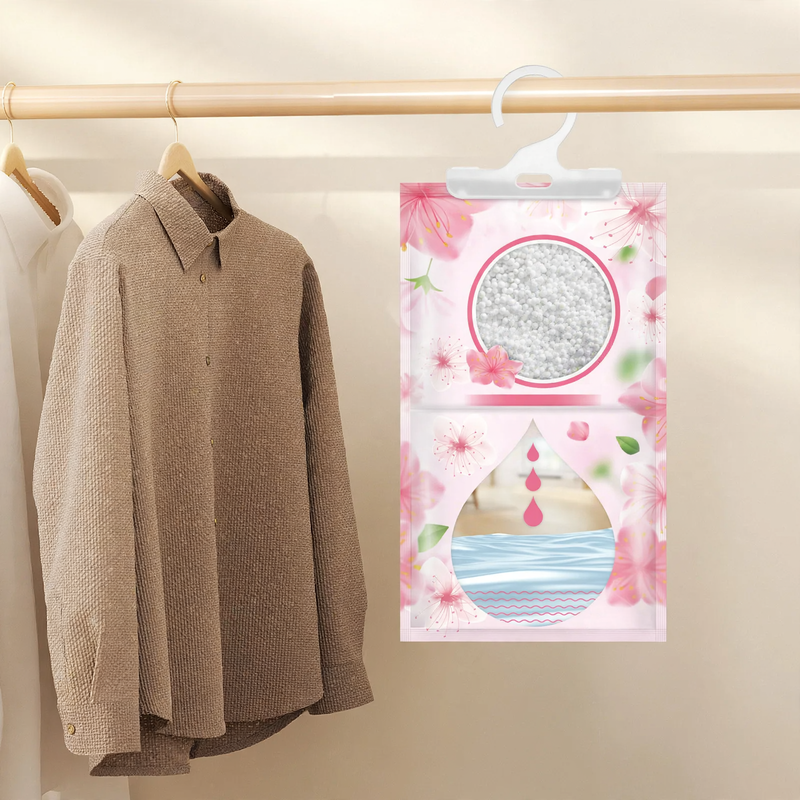 Fragrance dehumidifying bag for hanging in closets