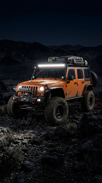 Rugged Orange Off-Road Vehicle in Desert Terrain at Night - Free mobile Wallpaper