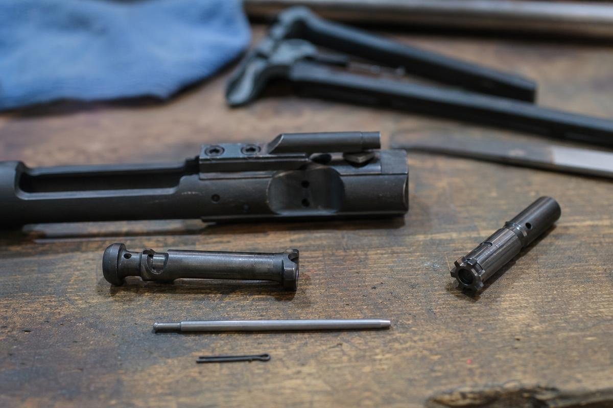 AR-15 extractor spring insert O-ring and roll pin inspection