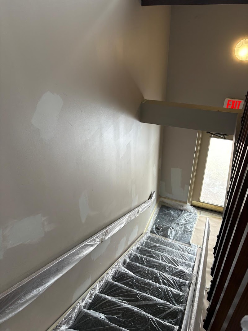 Yardley Court stairwell during repaint, surfaces masked and protected